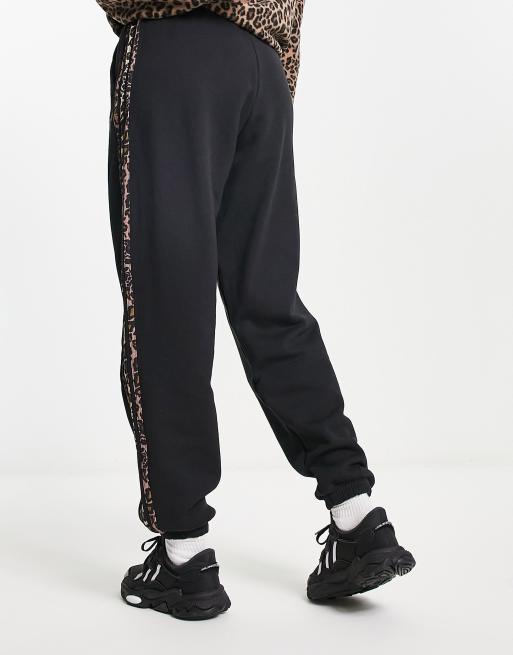 adidas Originals jogger with leopard print three stripe in black