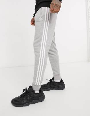 grey adidas tracksuit with white stripes