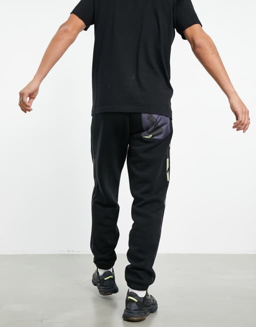 adidas Originals Joggers neri con tre strisce mimetiche