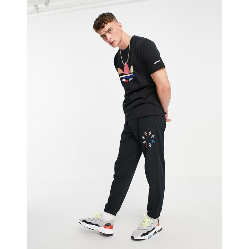 Uomo Pantaloni e leggings adidas Originals - Joggers neri con trifoglio scomposto