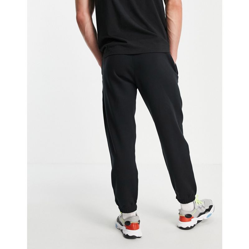 Uomo Pantaloni e leggings adidas Originals - Joggers neri con trifoglio scomposto