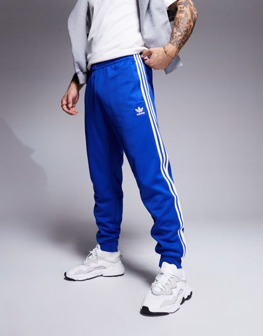 Blue adidas skinny joggers on sale