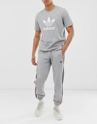 adidas originals joggers in grey with 3 stripes
