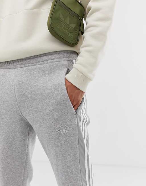 Adidas originals joggers with shop trefoil print in grey