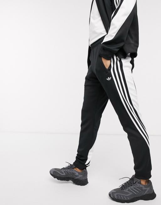 Adidas originals tracksuit hot sale black and white