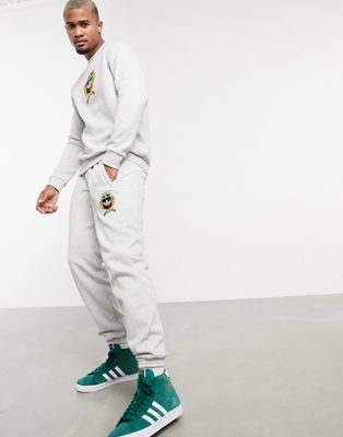 adidas Originals – Jogginghose mit College-Wappenmotiv aus grauem Fleece
