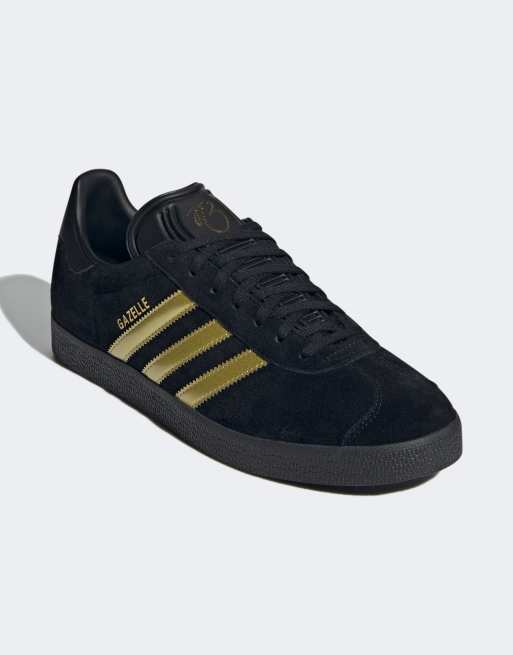 Adidas nere con strisce oro online