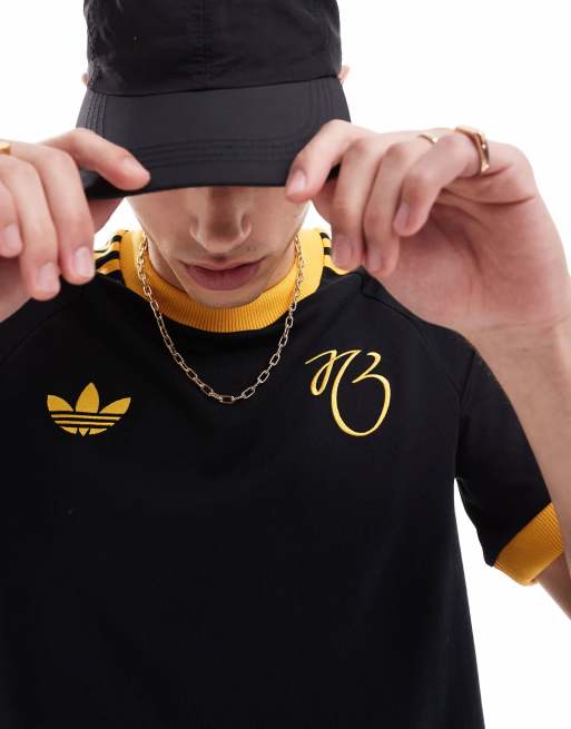 adidas Originals Jude Bellingham t-shirt in black and gold | ASOS