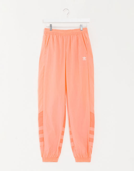 adidas Originals - Korallröda träningsbyxor med stor treklöverlogga