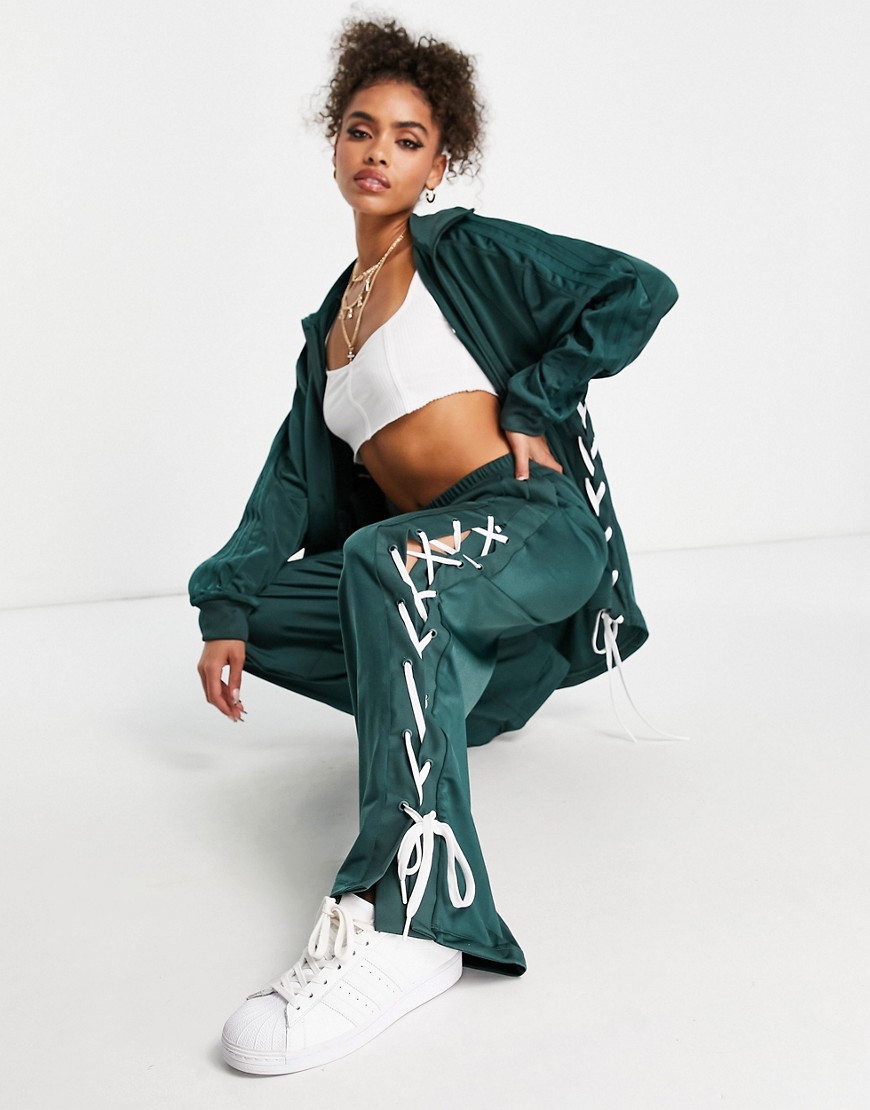 Adidas Originals laced up track pants in dark green