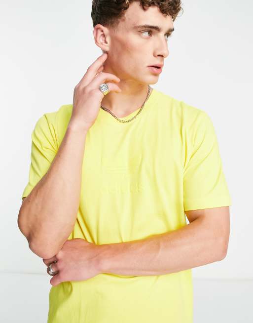 adidas Originals large debossed trefoil chest logo t-shirt in yellow