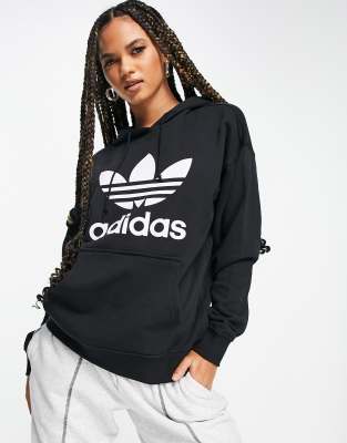 Susurro Volar cometa Oponerse a adidas Originals large logo hoodie in black | ASOS