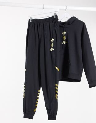 black and gold adidas sweatpants