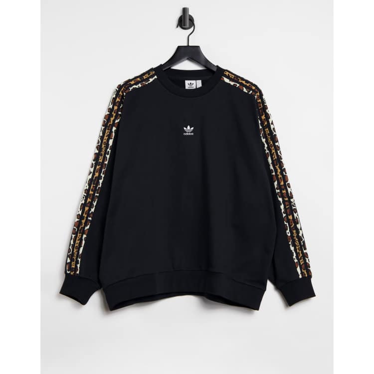 adidas Originals Leopard Luxe oversized sweatshirt in black with leopard three stripes