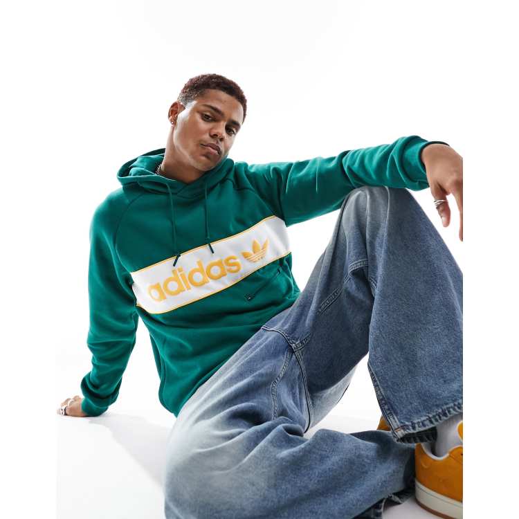 Green adidas hoodie with yellow logo on sale