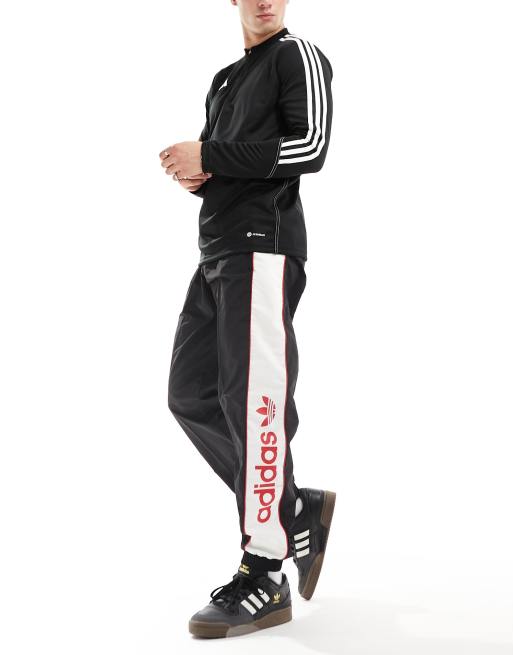 Adidas red best sale and black joggers