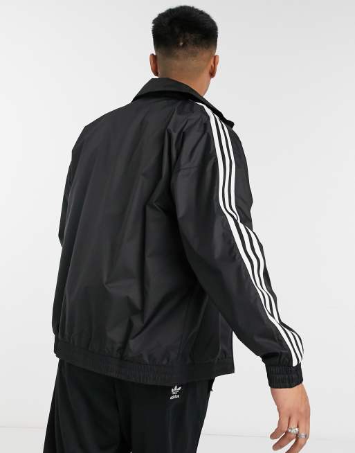 Adidas originals locked up logo track jacket in online black