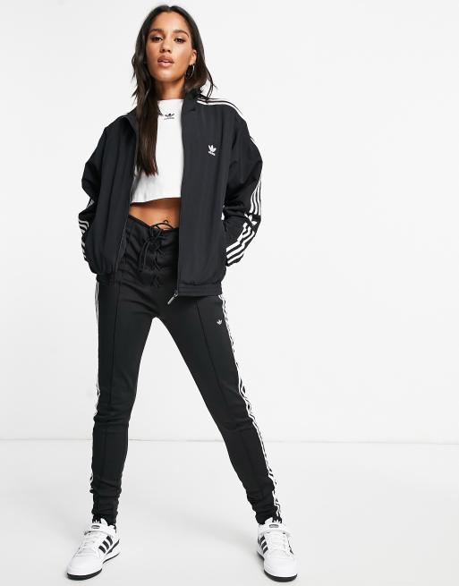 adidas Originals locked up logo track top in black ASOS