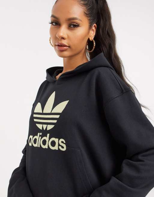 Black adidas hoodie hot sale with gold logo