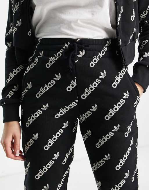 adidas Originals 'Logomania' triple logo joggers in black