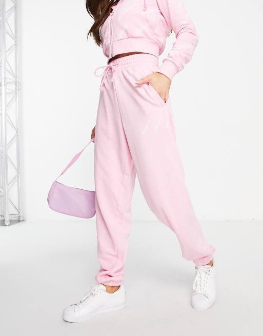 adidas Originals Logomania triple logo joggers in pink ASOS