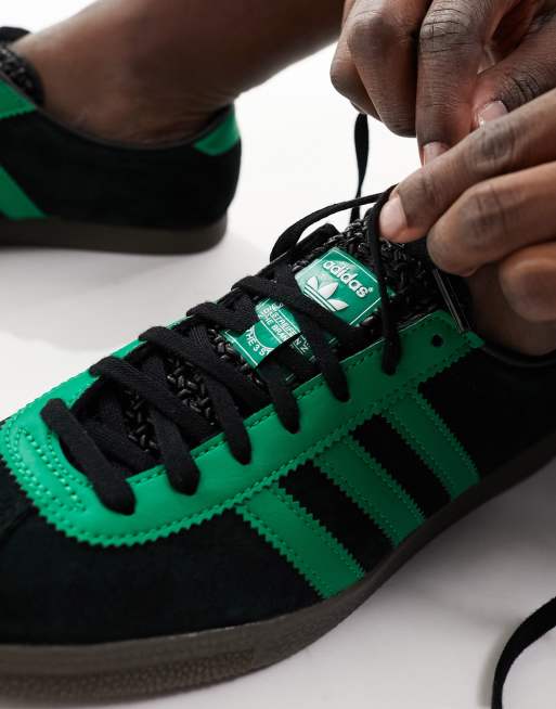 Green and black store adidas trainers