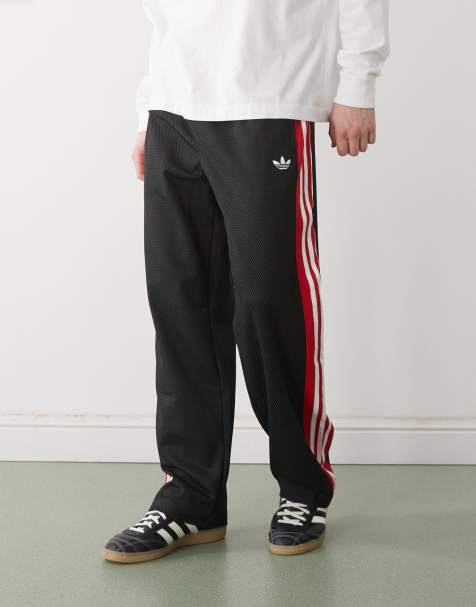 adidas Originals - Losvallende trainingsbroek van mesh in zwart - view 1