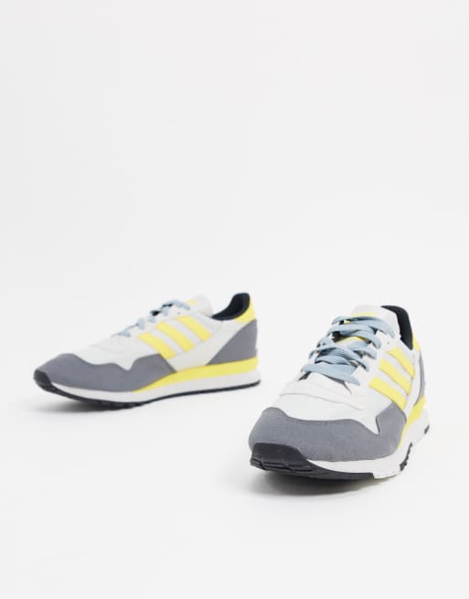 Grey and store yellow trainers