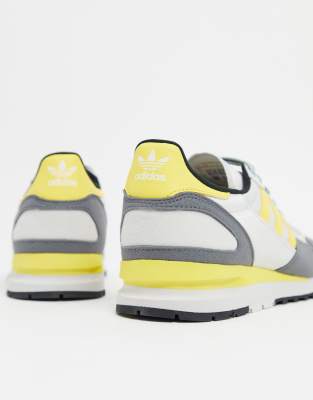 grey and yellow adidas trainers