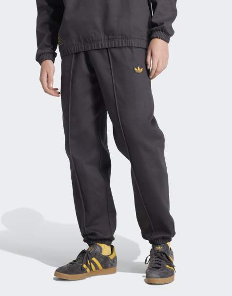 adidas Originals Manchester united terrace icons drill pants in utility black - view 1