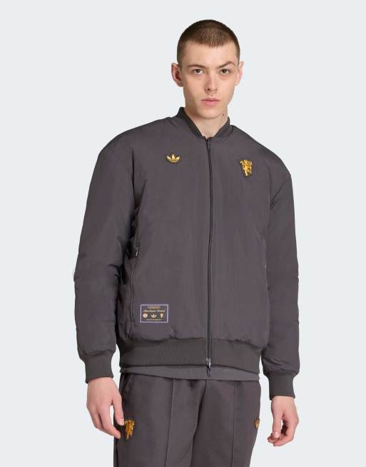 adidas Originals – Manchester United – Terrace Icons – Svart/blå jacka