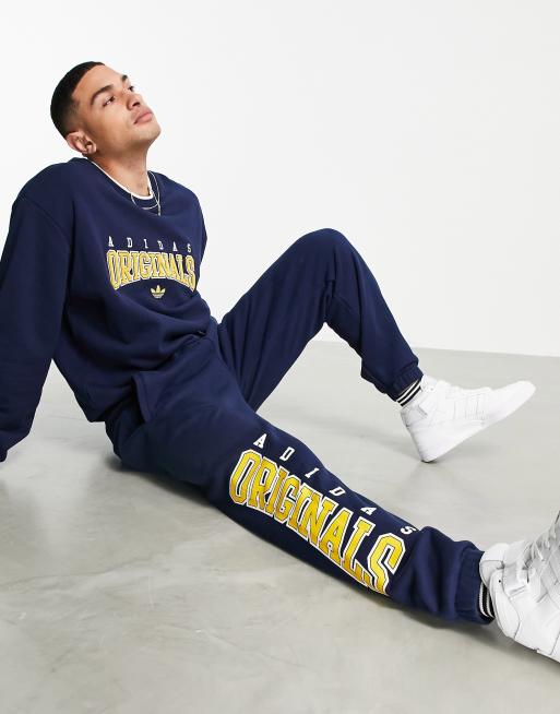 adidas Originals – Marinblå mjukisbyxor med Retro Revival-loggor