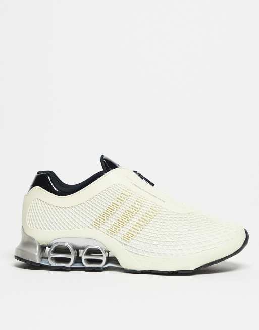 adidas Originals Megaride trainers in cream and black 