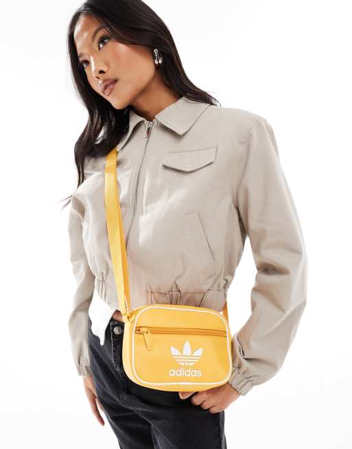 adidas Originals mini airline bag in yellow ASOS