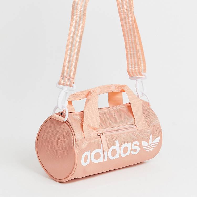 adidas Originals mini duffle bag in pink | ASOS