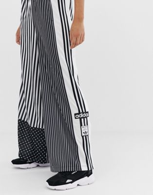 adidas originals mixed stripe popper pants in black and white