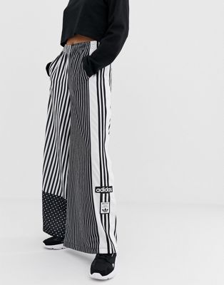 adidas originals three stripe popper pant with vintage logo in black