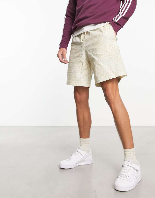 adidas Originals Monogram all-over print shorts in beige