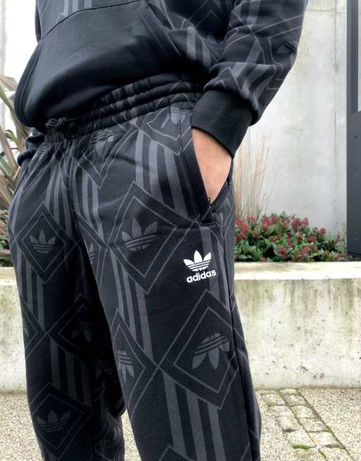 adidas Originals monogram trefoil joggers in black ASOS