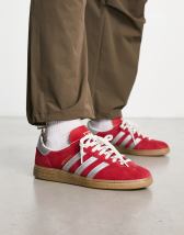 adidas Originals Munchen trainers in red with gum sole