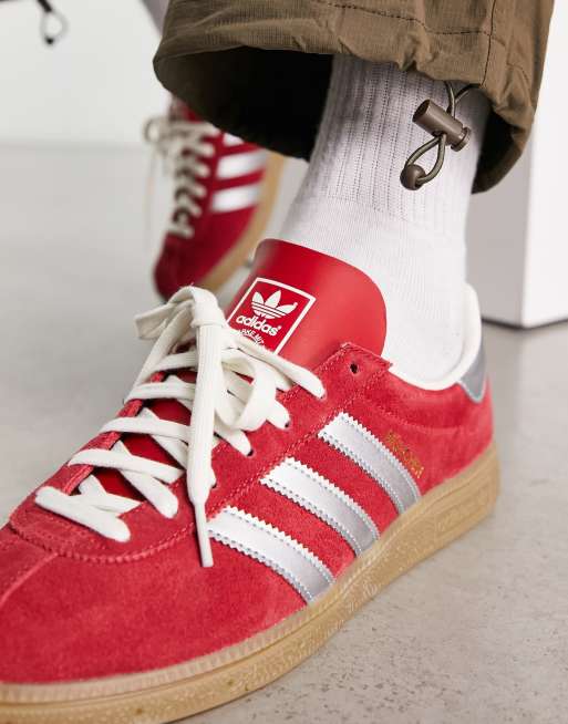 adidas Originals Munchen trainers in red with gum sole