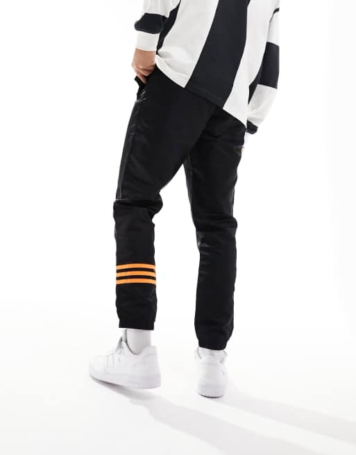 adidas Originals Neuclassics joggers in black and orange