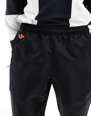 adidas Originals Neuclassics joggers in black and orange | ASOS