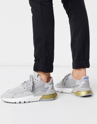 adidas originals nite jogger trainers in silver and gold