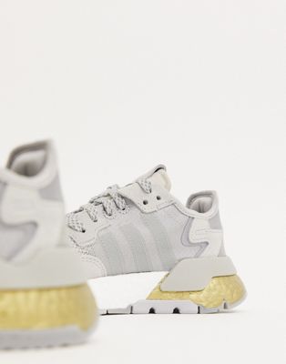 adidas originals nite jogger trainers in silver and gold