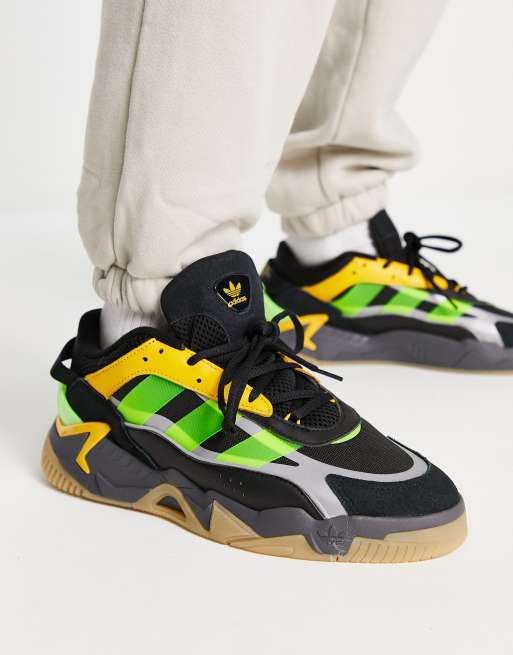 Black green and store yellow sneakers