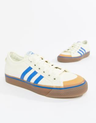 adidas originals nizza canvas trainers in white and blue