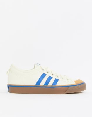 adidas originals nizza canvas trainers in white and blue