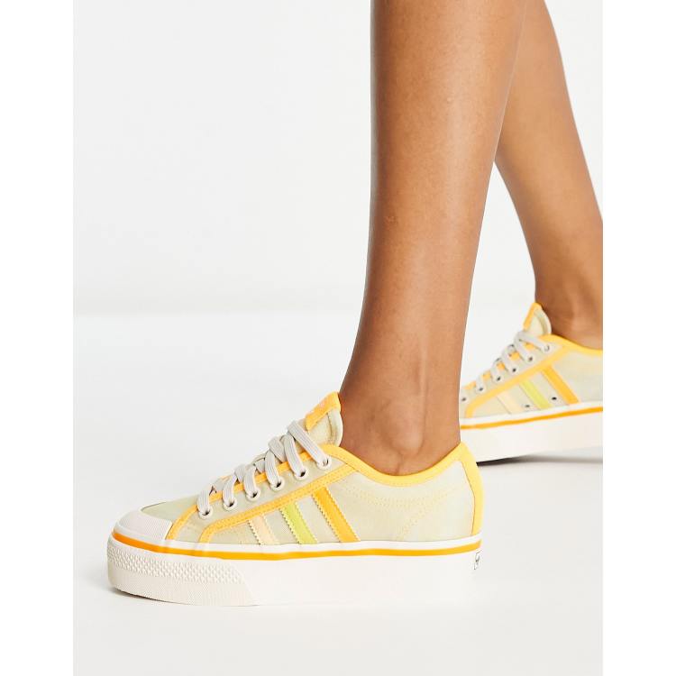 adidas Originals Nizza platform sneakers in almost yellow |