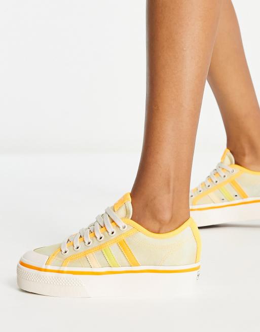 Og så videre klipning omhyggelig adidas Originals Nizza platform sneakers in almost yellow | ASOS